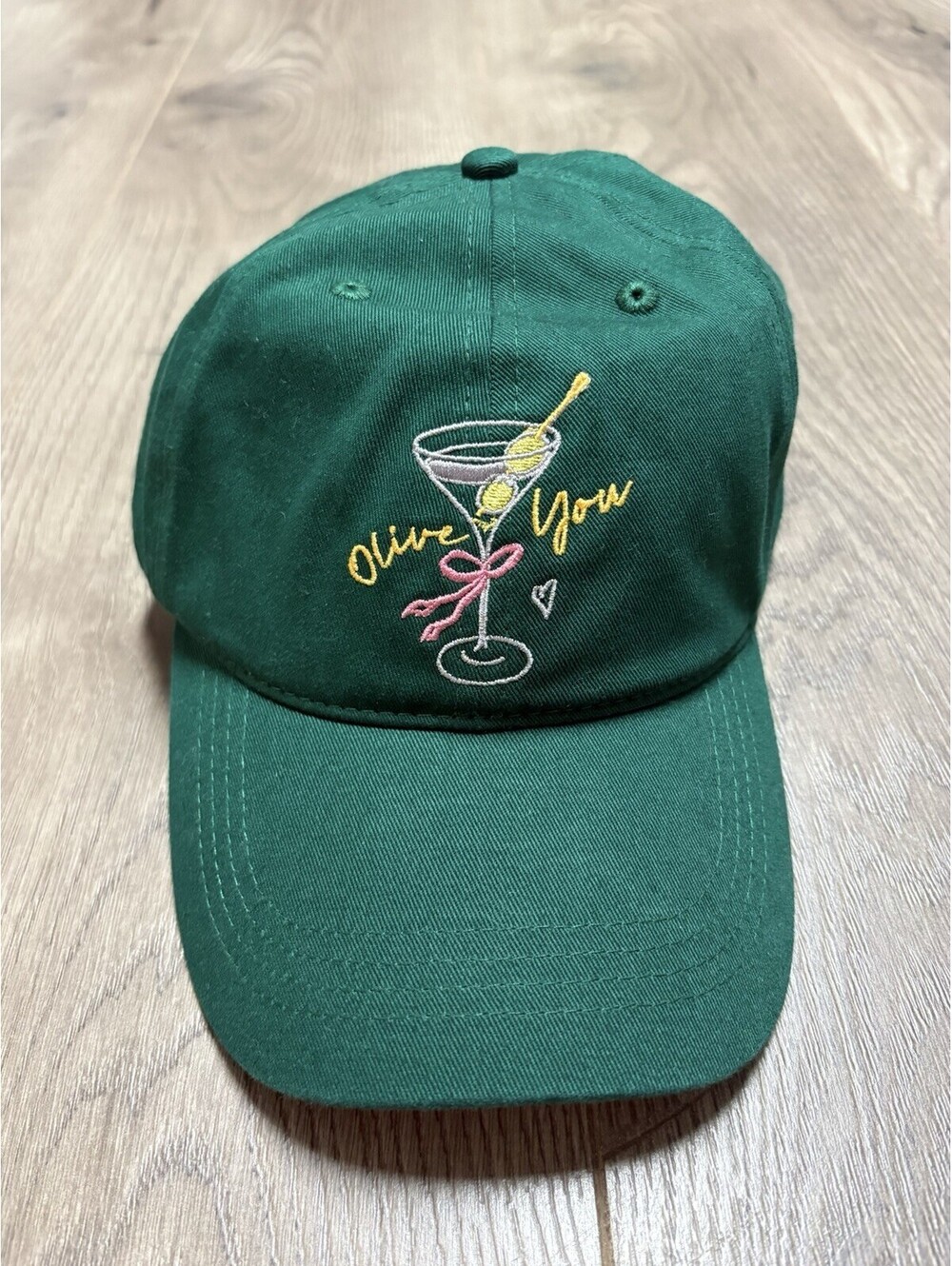 By Anthropologie Icon Baseball Cap One Size dirty martini Olive You Pink Bow